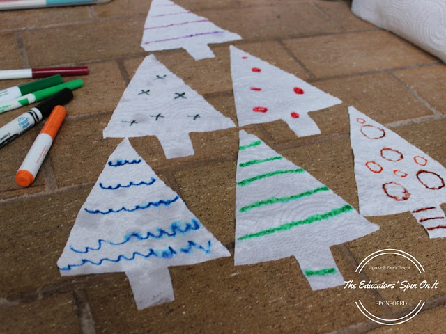 Let the child add ornaments to the tree with different colored markers. Try a variety of lines, circles, and waves.