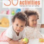2 Toddlers Playing at White Table with Toddler Toys on Bookcase