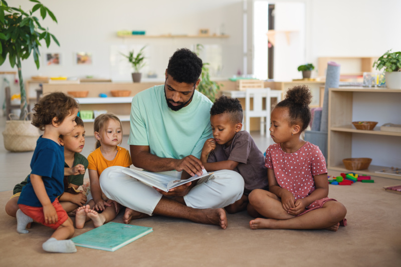 adult-reading-diverse-books-to-children - The Educators' Spin On It Adult reading books for children