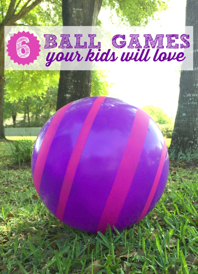 ball-games-for-kids - The Educators' Spin On It Large Purple Ball with hot pink stripes on grass with ball games for kids featured