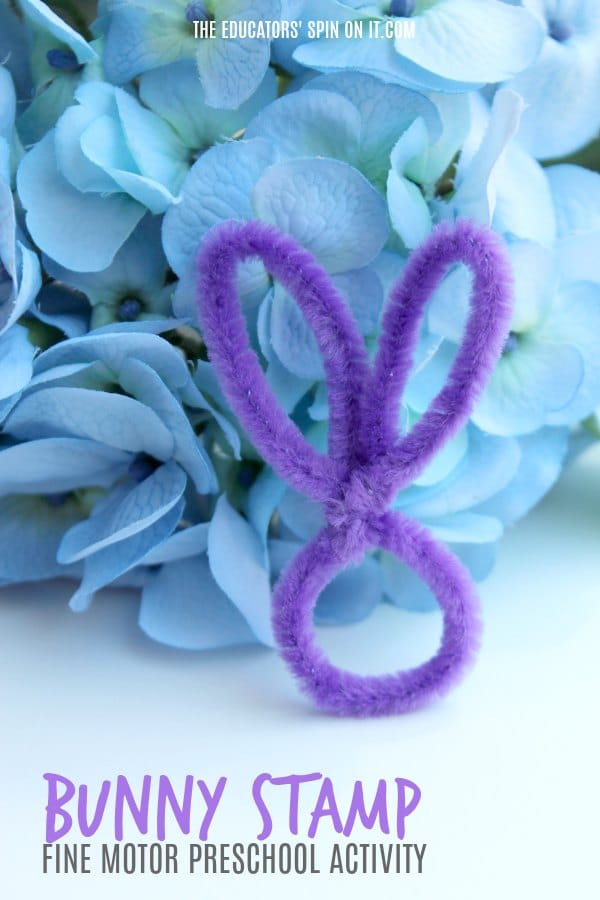 Bunny Stamp Fine Motor Preschool Activity for Spring - The Educators' Spin On It Pipe Cleaner in shape of rabbit head in front of spring hydrangea flowers