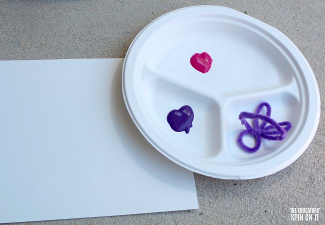 Bunny Stamp Paint Activity setup - The Educators' Spin On It Bunny Stamp with Paint set up on sectioned paper plate