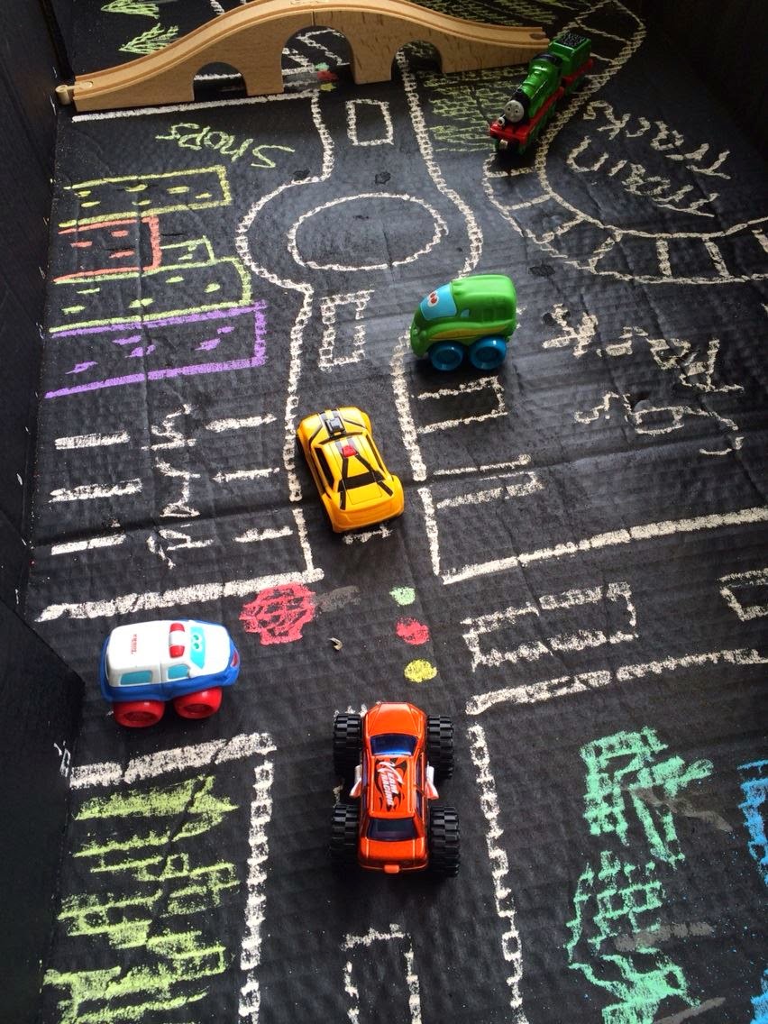 chalkboard%2Bbox%2B3.jpg - The Educators' Spin On It Chalk drawn town with roads in cardboard box and toy cars.