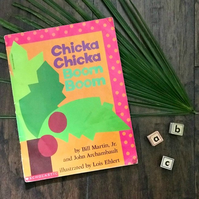 Chicka-Chicka-Boom-Boom-Book-Cover-with-ABC-Stamps-and-Palm-Tree- - The Educators' Spin On It Book cover of the book Chicka Chicka Boom Boom with Coconut Tree and abc stamp blocks on Wooden floor with palm frawn.