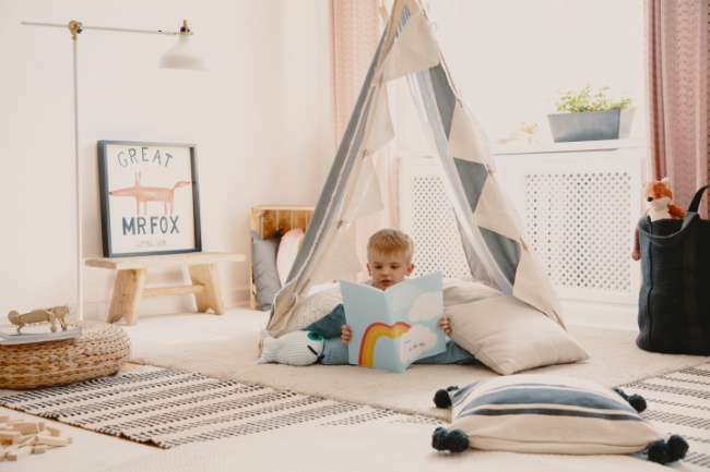 child-reading-in-tent - The Educators' Spin On It Child reading in a tent