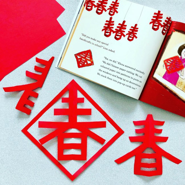 chinese-new-year-lanterns - The Educators' Spin On It Red paper Chinese lanterns with book about Chinese New Year