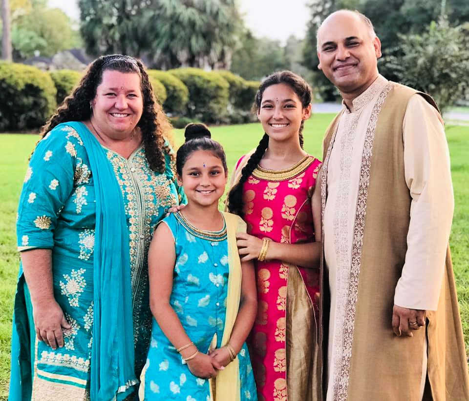 family-celebrating-diwali-wearing-traditional-Indian-clothing - The Educators' Spin On It Family Celebrating Diwali wearing Traditional Indian Clothing