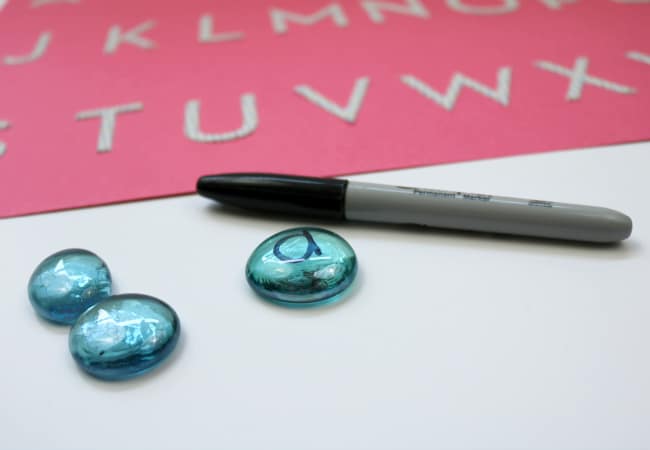glass-gem-game-the-cat-in-the-hat - The Educators' Spin On It alphabet letters on glass gems with permanent marker