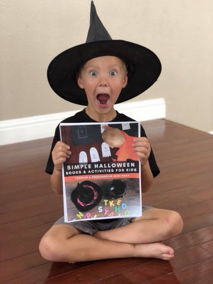Halloween ebook for Preschoolers and Toddlers with Activities & Books - The Educators' Spin On It Boy with Witch Hat Holding Printable Halloween ebook for Preschoolers and Toddlers with Activities & Books
