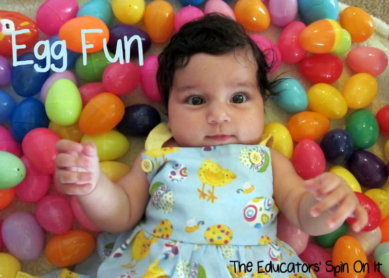 IMG_1698.JPGAblog.jpg - The Educators' Spin On It baby laying in easter eggs for sensory play