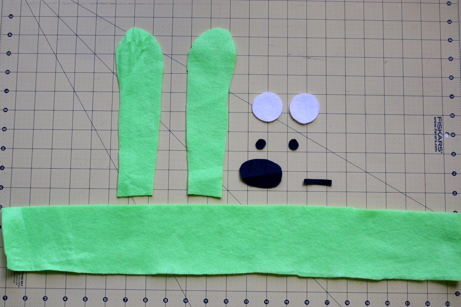 Step 2 of the Bunny Costume, cut the ears, eyes, nose and mouth out of felt