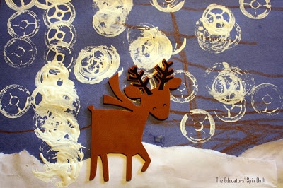 IMG_9048.JPG - The Educators' Spin On It Reindeer art with spool snowflakes on blue paper