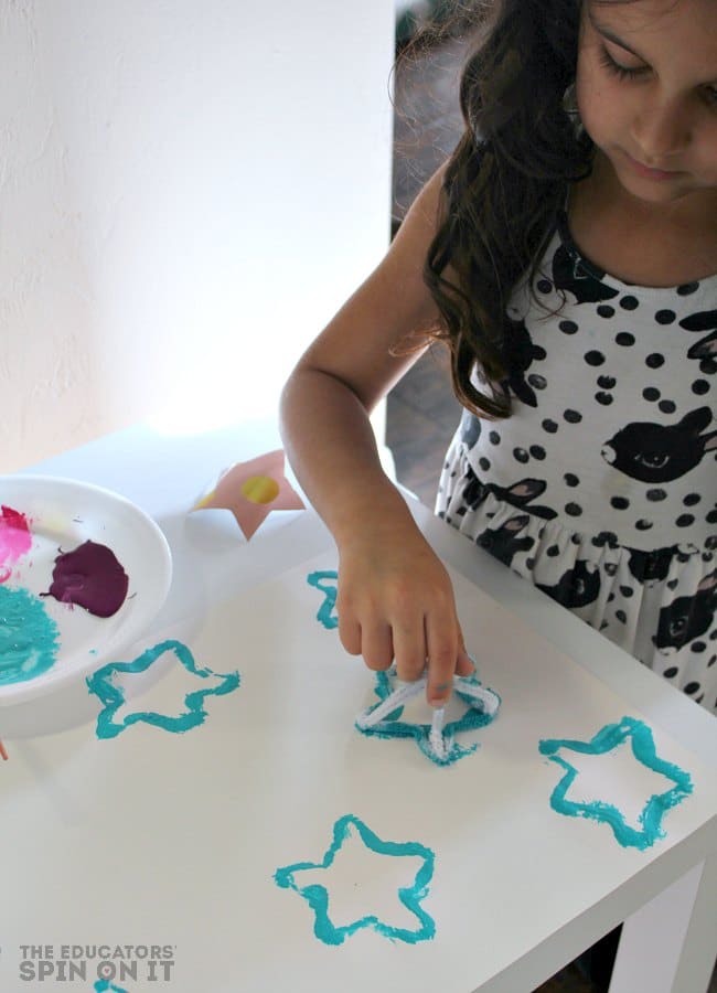 Kids Painting with Star Shaped Stamps - The Educators' Spin On It Kids Painting with Star Shaped Stamps
