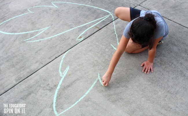 making-sidewalk-chalk-coconut-tree-with-kids- - The Educators' Spin On It Child making palm frawns with green sidewalk chalk