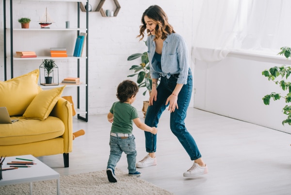 mom-dancing-with-son-for-playtime - The Educators' Spin On It parent dancing with son in living room