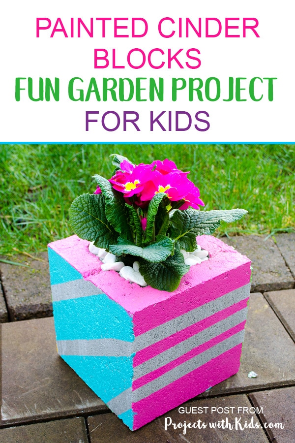 painted-cinder-blocks-short-pin1-1 - The Educators' Spin On It Pink Flowers planted inside of painted cinder block