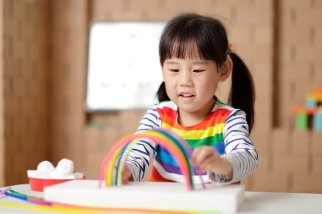preschooler-making-rainbow - The Educators' Spin On It Child making a rainbow