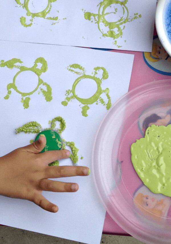 Sea-Turtle-Stamping-with-Lids-600x857-1 - The Educators' Spin On It DIY Sea Turtle Stamps with kids