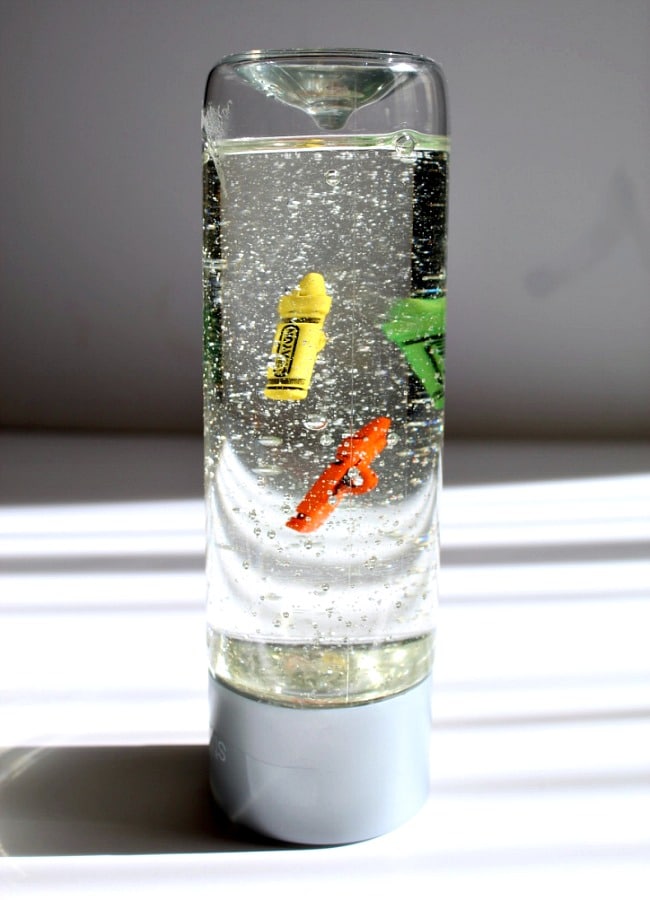 Sensory Bottle Density Science Test with Kids - The Educators' Spin On It Sensory Bottle Density Science with Crayon Theme