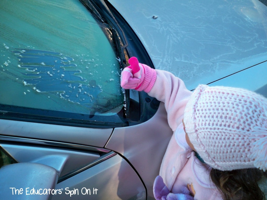 Signs+of+Winter+Frost+on+the+Car.jpg - The Educators' Spin On It signs of winter frost on car with child scraping windshield