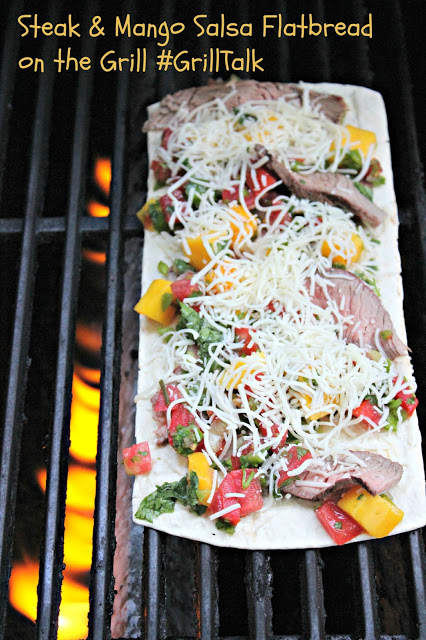 Steak%2Band%2BMango%2BSalsa%2BFlatbread.jpg - The Educators' Spin On It Flatbread pizza on grill with peppers, mangos, cheese and steak