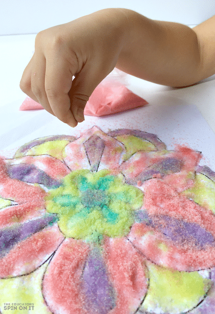 Using Colored Sand to create Rangoli Craft Idea for Kids for Diwali to encourage kids to learn about the world.